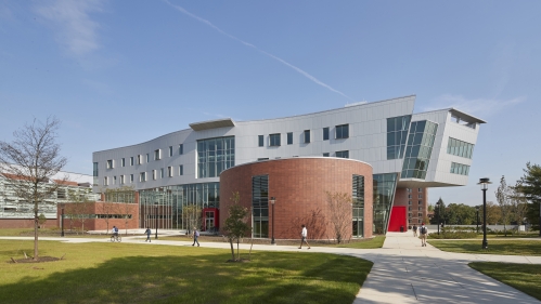 View of a campus building with blue sky.