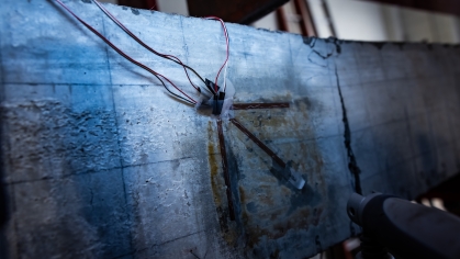 concrete slab in a lab with sensors attached.