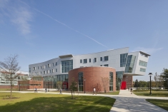 View of a campus building with blue sky.